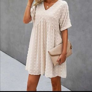 Swiss dot, knee length spring/summer dress. Great neutral to dress up or down.